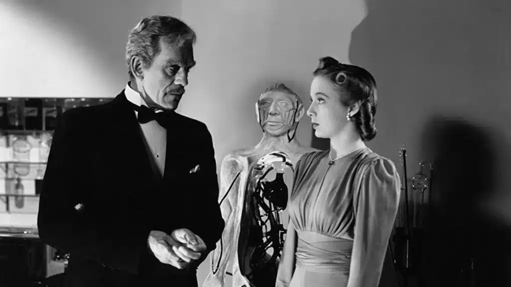 Σκηνή από την ταινία «Before I Hang» (1940), με τον Δρ. Τζον Γκαρθ και μια γυναίκα σε εργαστήριο, δίπλα σε ανθρώπινο ομοίωμα.