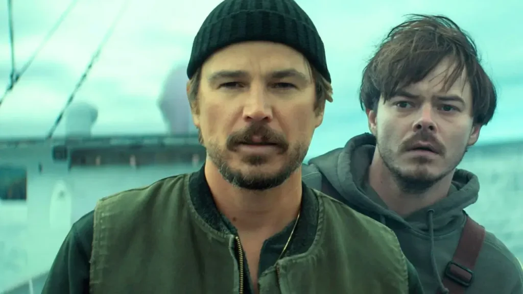 Δύο άνδρες (Josh Hartnett, Charlie Heaton) κοιτάζουν ανήσυχοι μπροστά τους σε σκηνή από τη σειρά Below (2026) του Netflix.